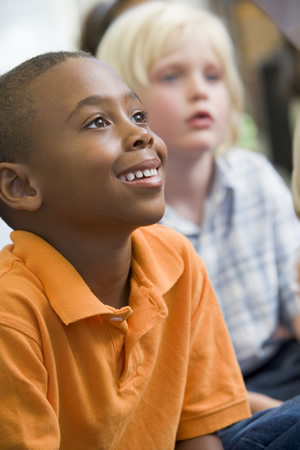 Kid in Orange Shirt at Preschool 