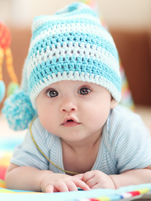 Infant in Blue and White Hat 